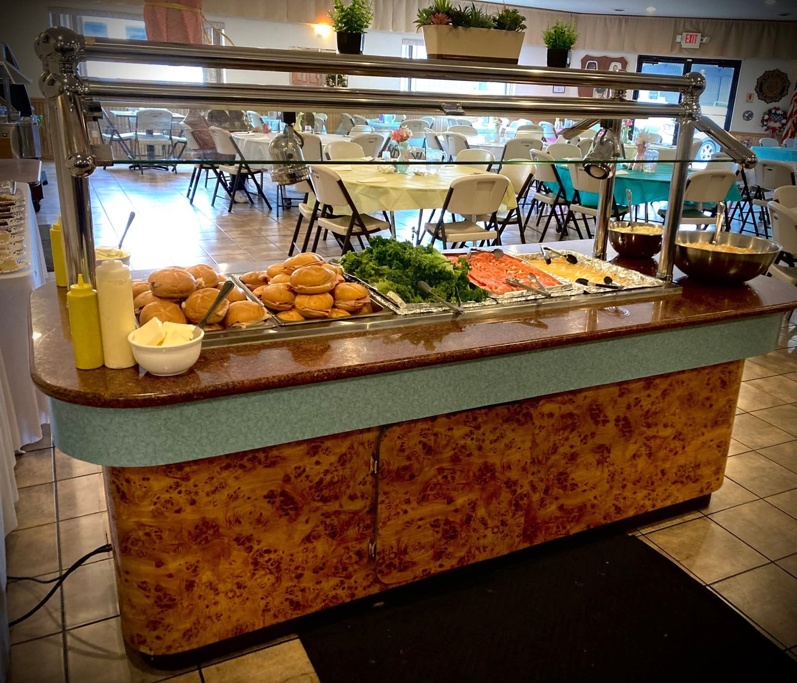 Buffet line with sandwiches and fixings ready for guests